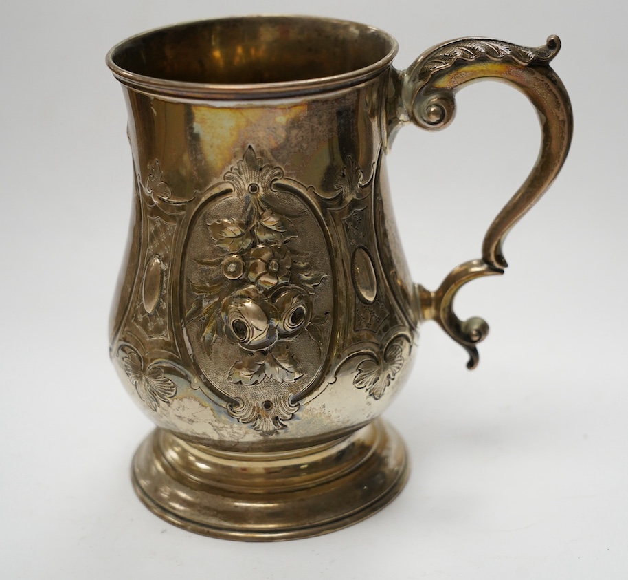 A Victorian repousse silver baluster mug, by Robert Harper, London, 1868, height 13.1cm, 8.9oz. Condition - fair